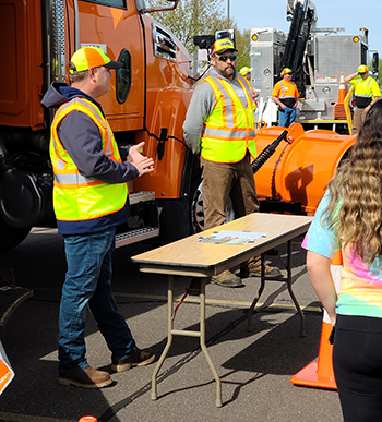 Photo: Dan Meinen and Joel Schleicher gave students a tour of a snowplow. 